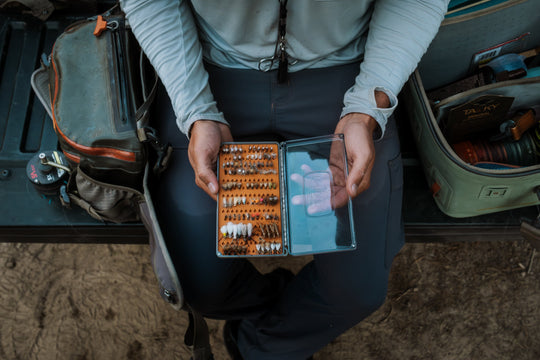 Angler using the Fishpond Tacky Original Fly Box Burnt Orange
