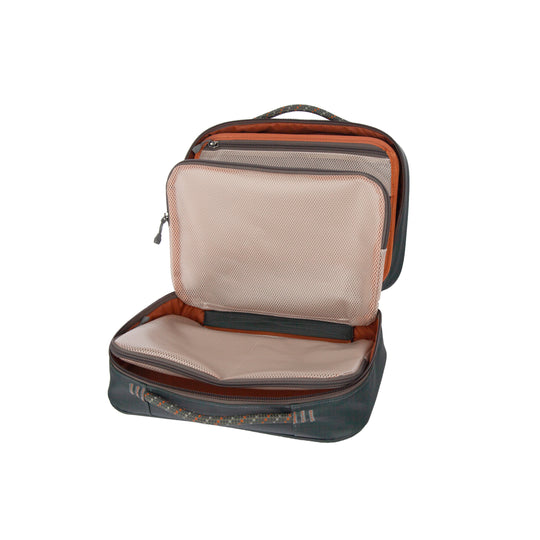 Fishpond Backwater Fly Tying Kit open showing mesh pouches and tool page