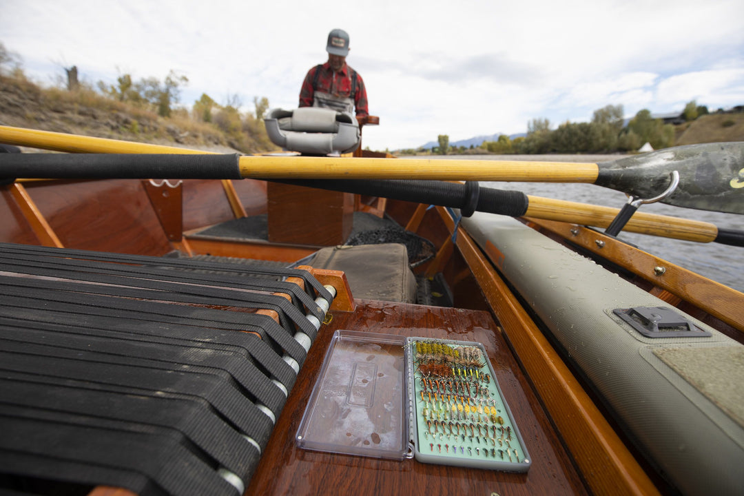 Angler using the Fishpond Tacky Original Fly Box on the river